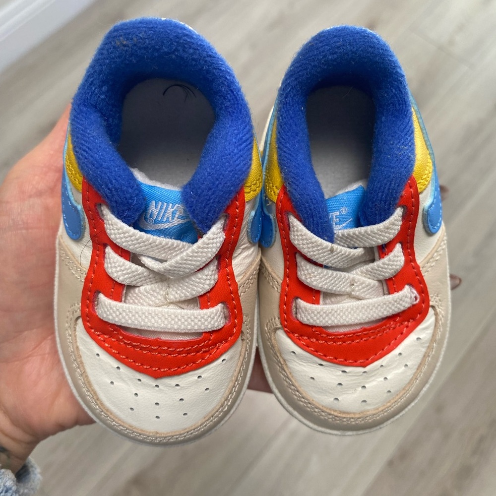 Nike Baby Sneakers with Red, Blue, and Yellow Accents